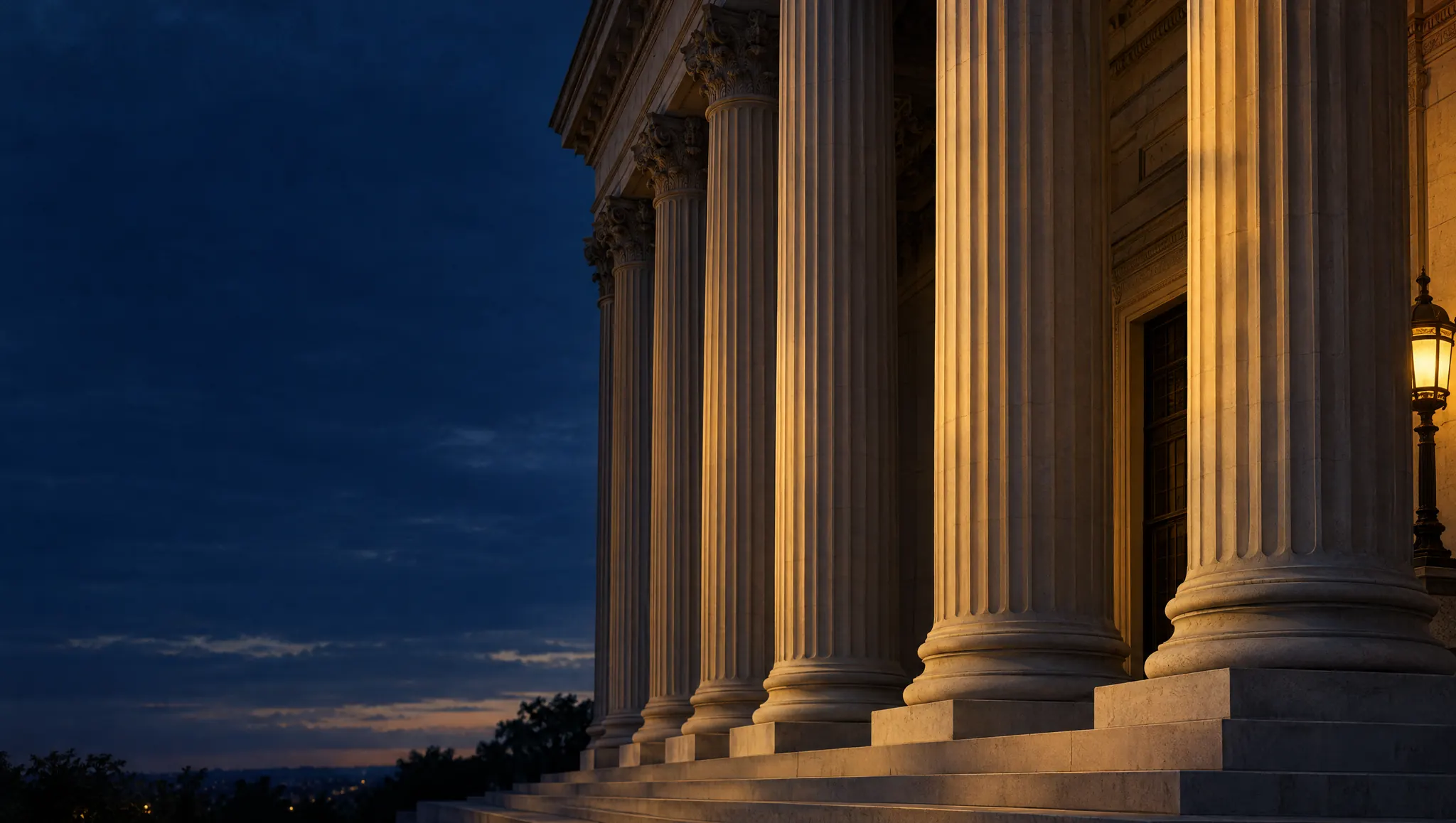 Classical stone columns of a historic courthouse at twilight